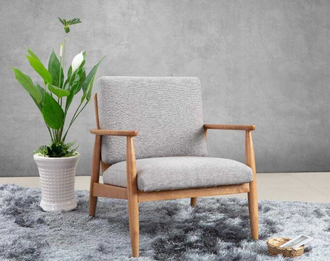 Sofa đơn vải nỉ trang trí cùng cây xanh và thảm cùng màu
